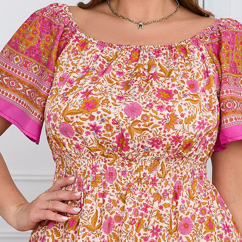 Elegant bohemian dress featuring floral print off-shoulder top with smocked waist