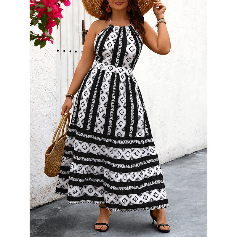 Black and white patterned halter maxi dress showcasing elegant fashion and luxurious style