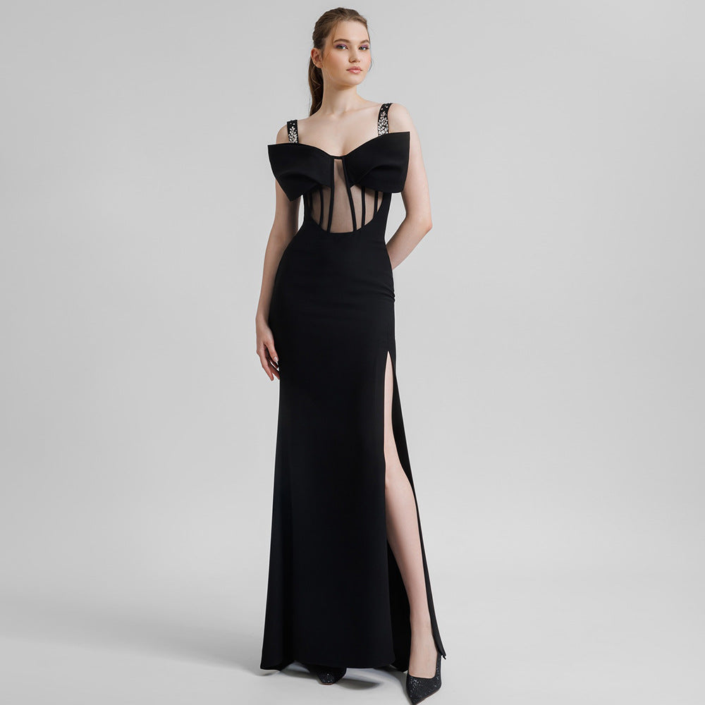 Elegant black maxi dress featuring sheer corset panels and thigh-high slit in fashion