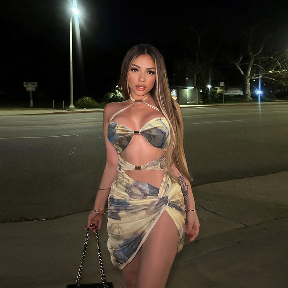 Woman in a revealing patterned split dress showcasing summer fashion trends