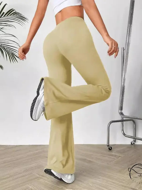 V shaped waist slimming bootcut trousers in light tan, high-waisted flared yoga style