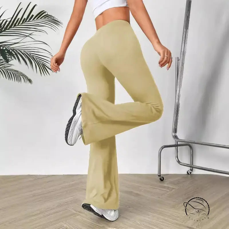 V shaped waist slimming bootcut trousers in light tan, high-waisted flared yoga style