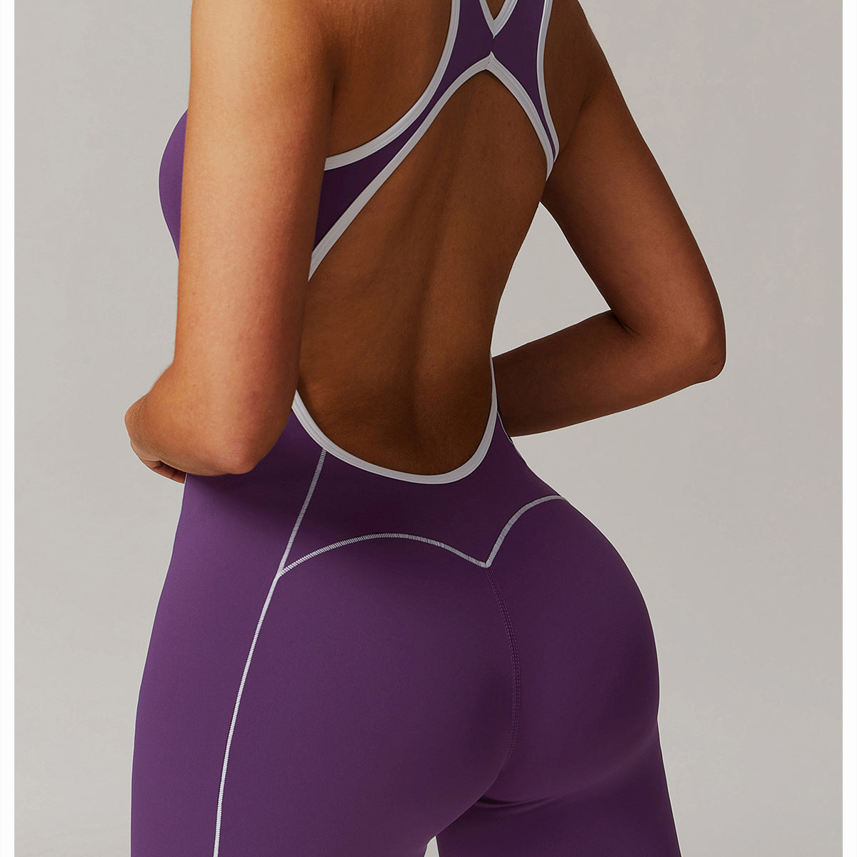 Purple athletic jumpsuit with open back from Hip Lifting Pleated Slightly Pull Yoga Jumpsuit, langry fashion ملابس
