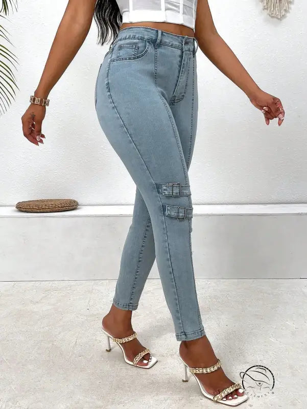 High elastic skinny jeans in light blue with buckle details