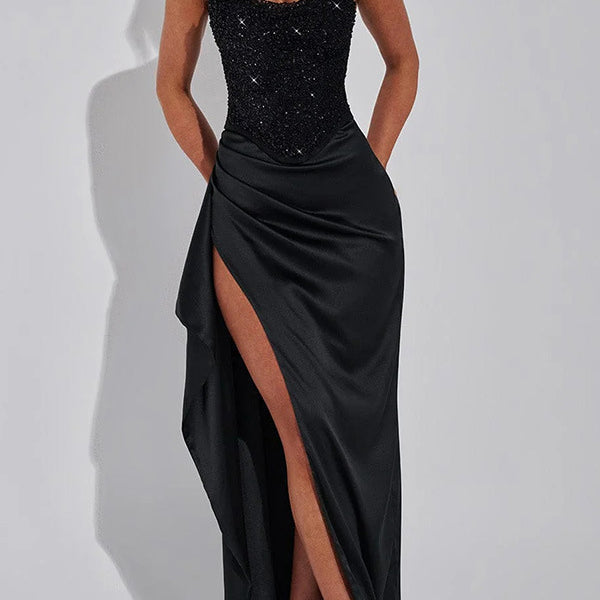 Black strapless corset gown with thigh-high slit, perfect for a stylish split dress look