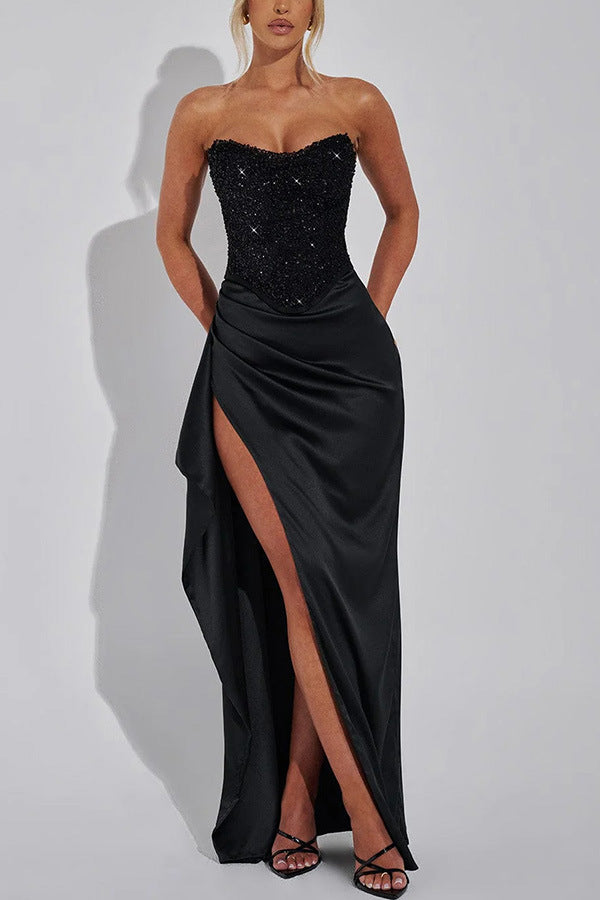 Black strapless corset gown with thigh-high slit, perfect for a stylish split dress look
