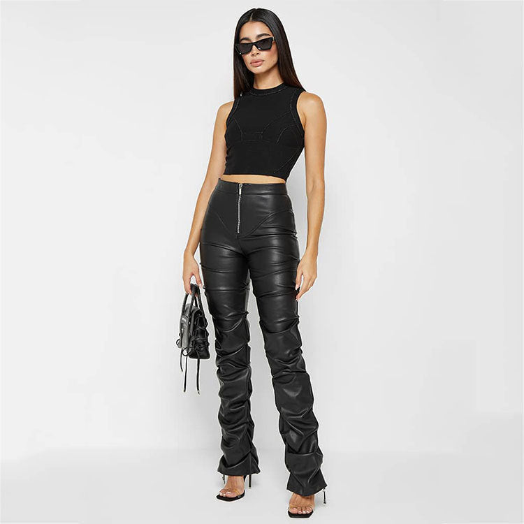 Woman in black crop top and ruched faux leather pants from the Langry fashion collection