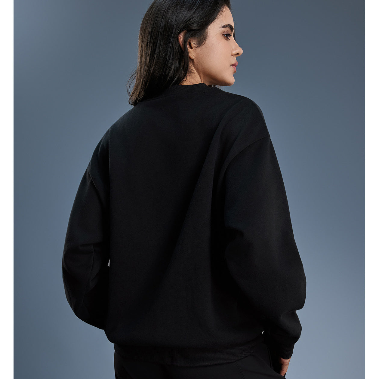 Black long sleeve fleece hoodie with ribbed cuffs and hem