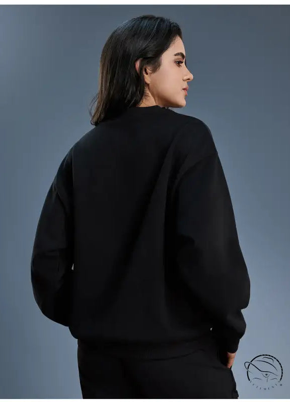 Black long sleeve oversized fleece hoodie with ribbed cuffs