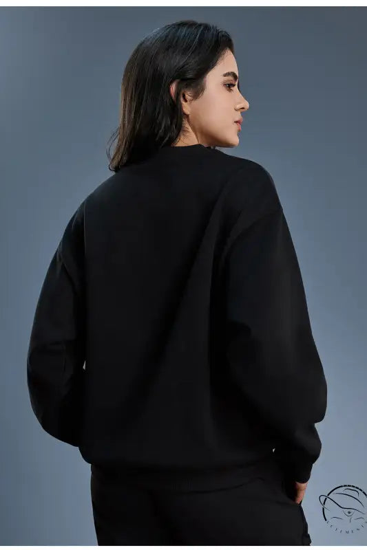 Black long sleeve oversized fleece hoodie with ribbed cuffs