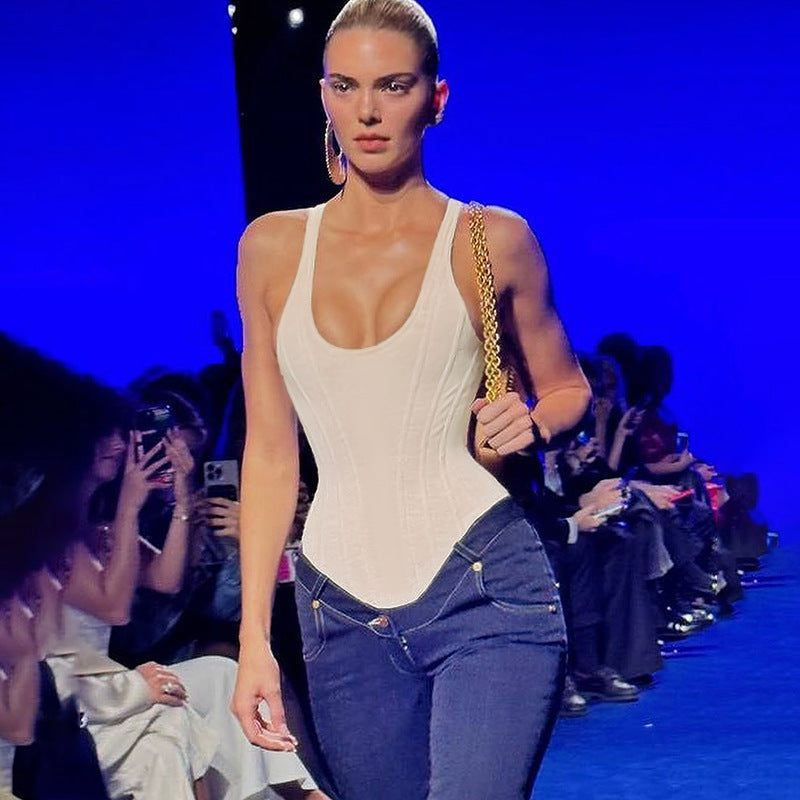 Model wearing a white bodysuit and low-rise jeans from Casual Wild Cute Vest fashion collection