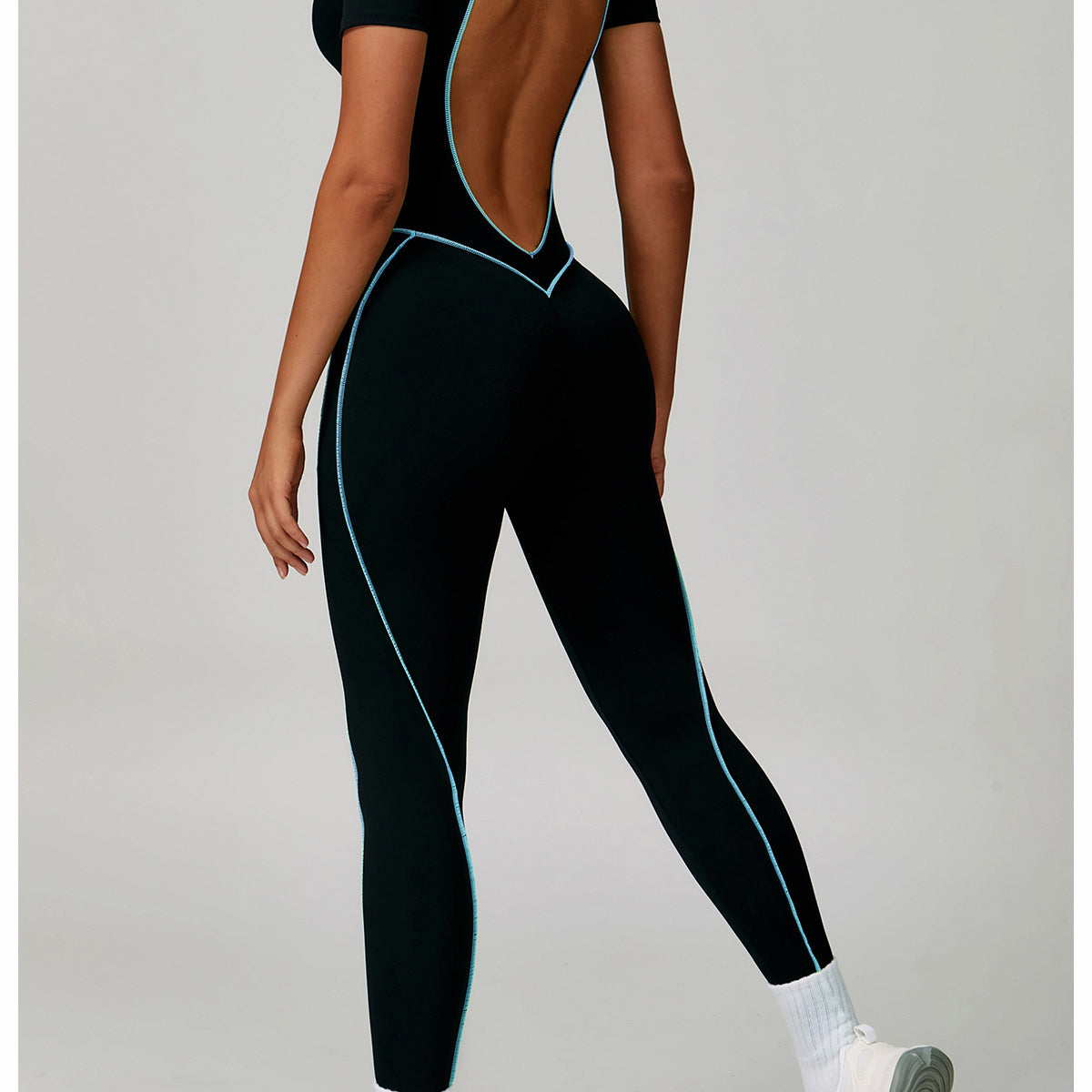 Lululemon Beauty Back Tight Jumpsuit: Black langry leggings with white stripes, cutout back for yoga fashion