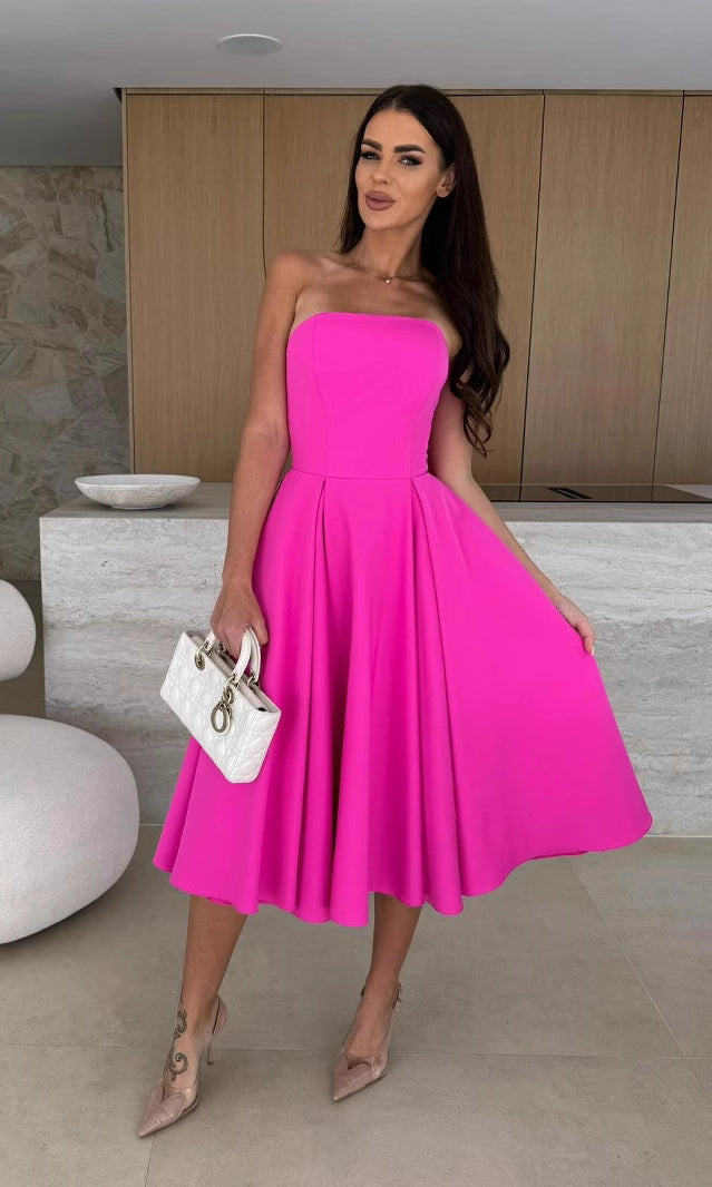 Woman in a vibrant pink strapless dress showcasing Langry fashion ملابس for elegant style