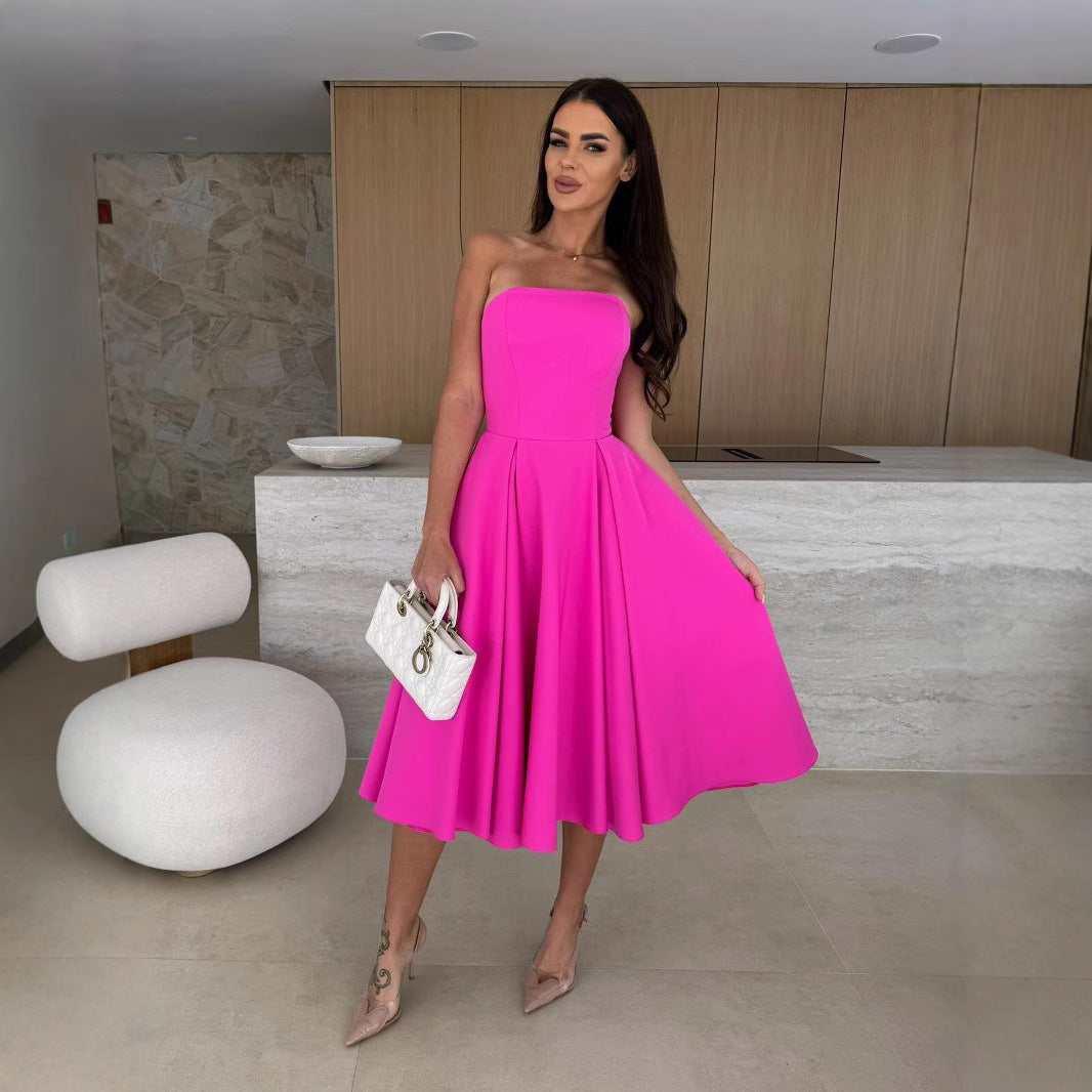 Woman in a vibrant pink strapless dress showcasing Langry fashion ملابس for elegant style