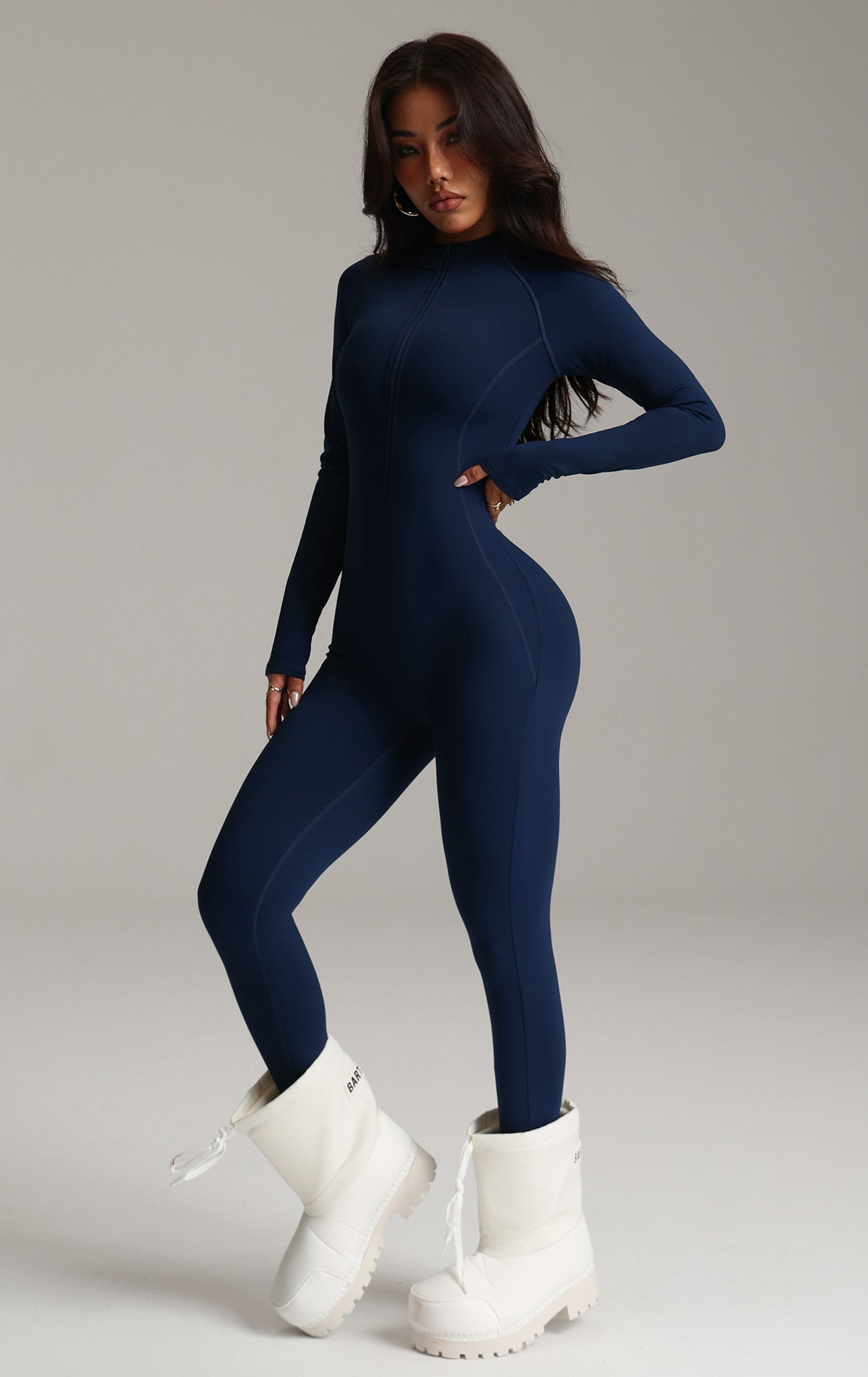 Navy blue long-sleeved langry fashion bodysuit with white fluffy boots