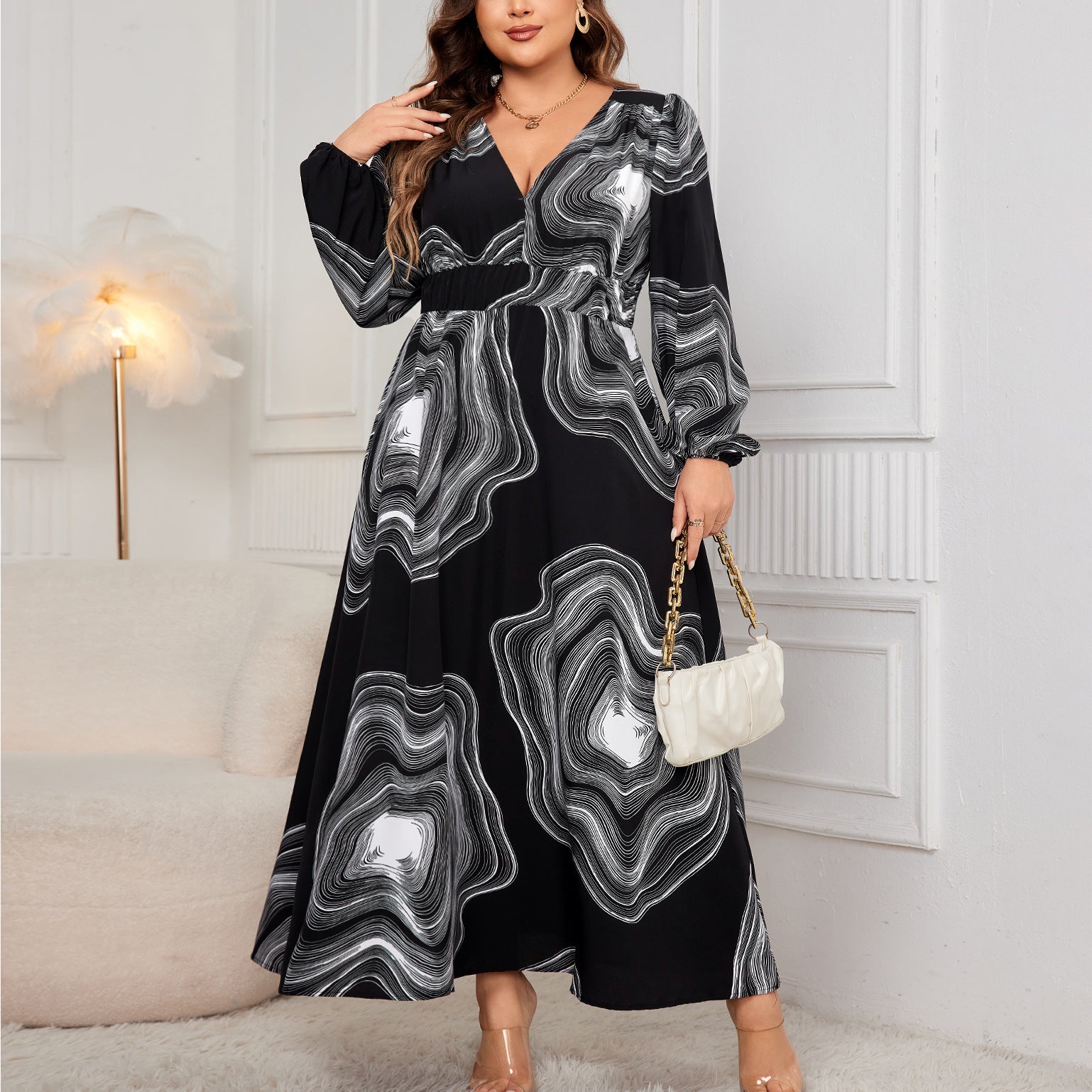 Elegant black and white patterned maxi dress showcasing stylish ملابس for fashion enthusiasts