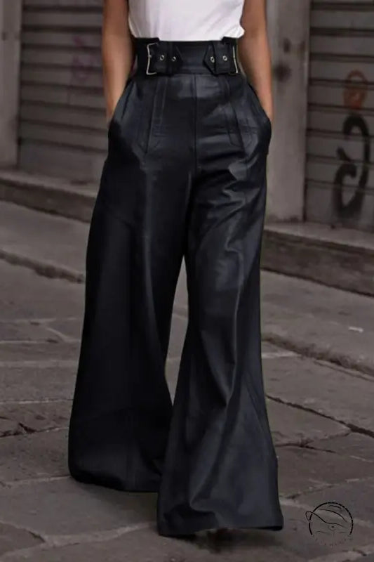 Black faux leather bell bottom pants with high waist and buckle details