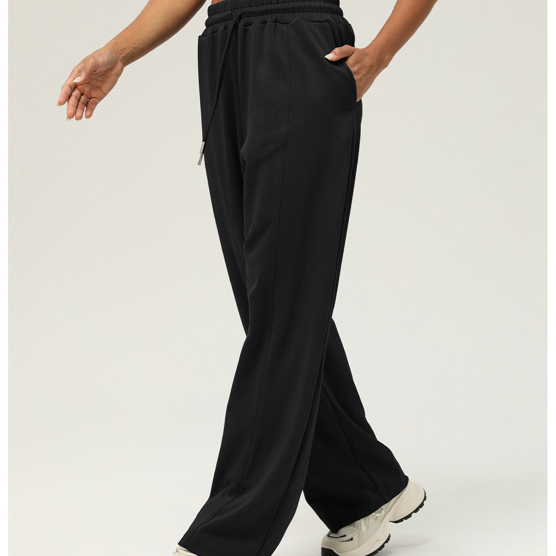 Black wide-leg sweatpants for casual fitness and yoga, featuring elastic waistband and pockets