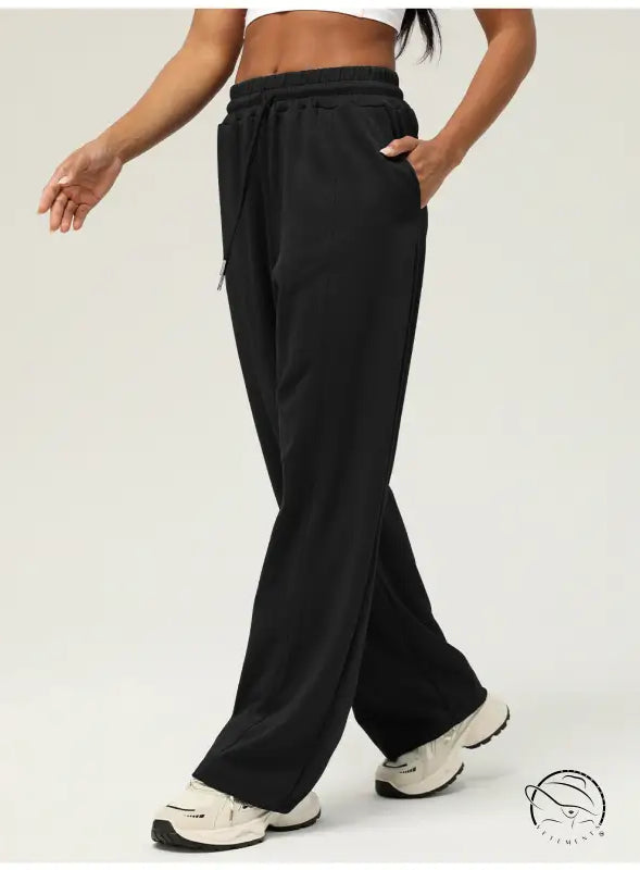 Black casual fitness yoga pants with wide-leg design, elastic waistband, side pockets