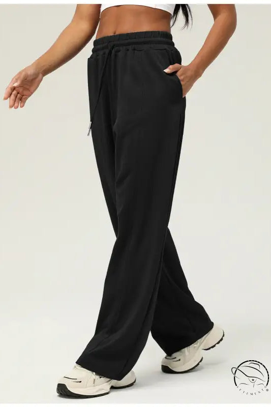 Black casual fitness yoga pants with wide-leg design, elastic waistband, side pockets