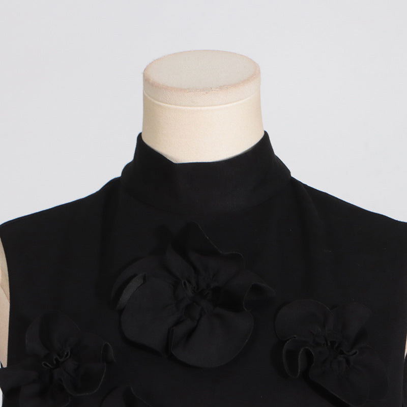 Black sleeveless top with floral embellishments featuring tie bow detail in fashion style