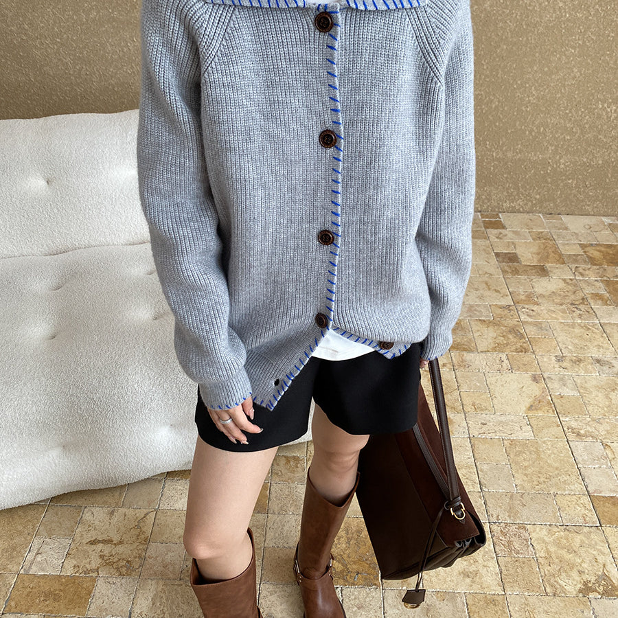 Light gray knit cardigan coat with square neckline, dark buttons, and regular sleeves