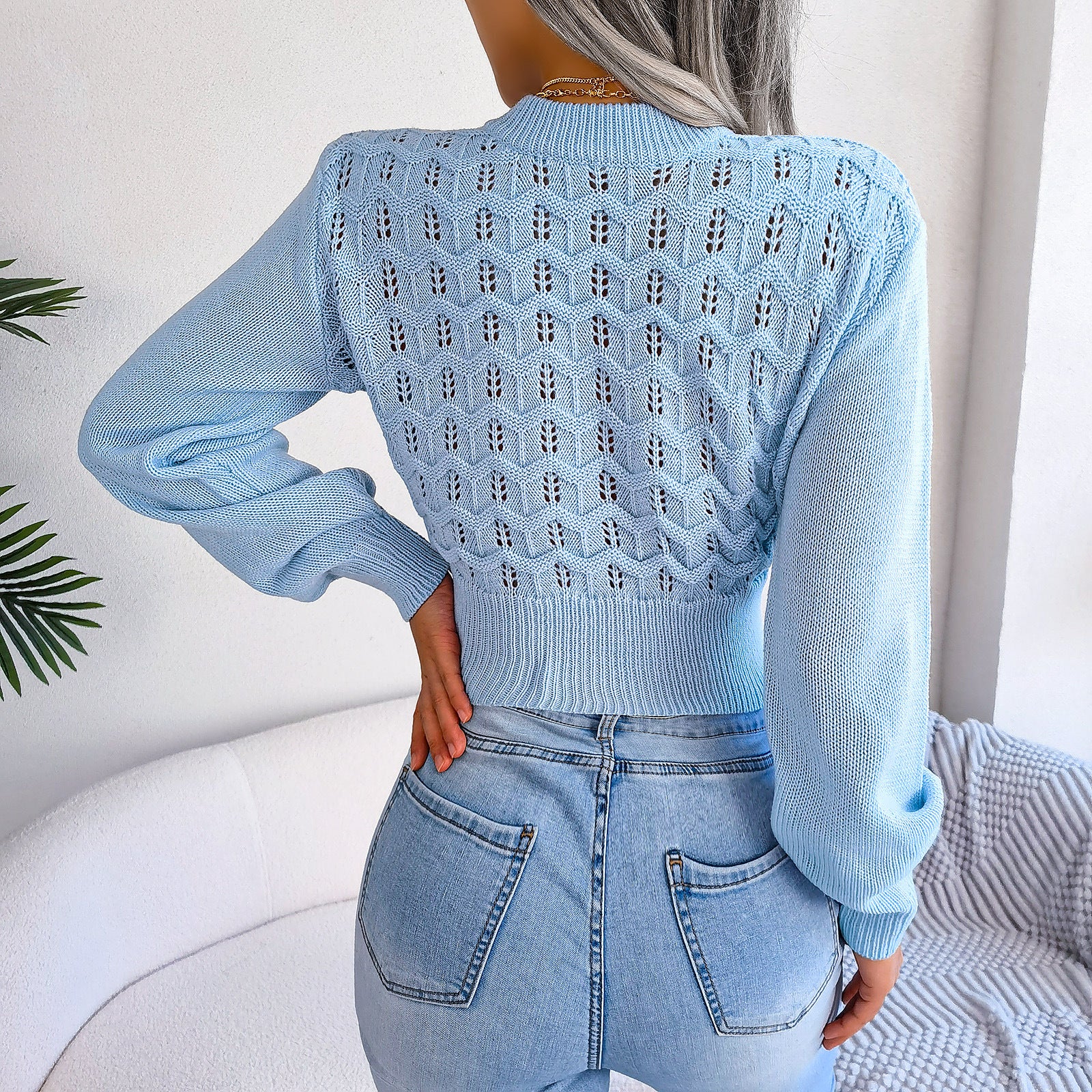 Light blue lantern sleeve cropped knitted sweater paired with stylish jeans in fashion