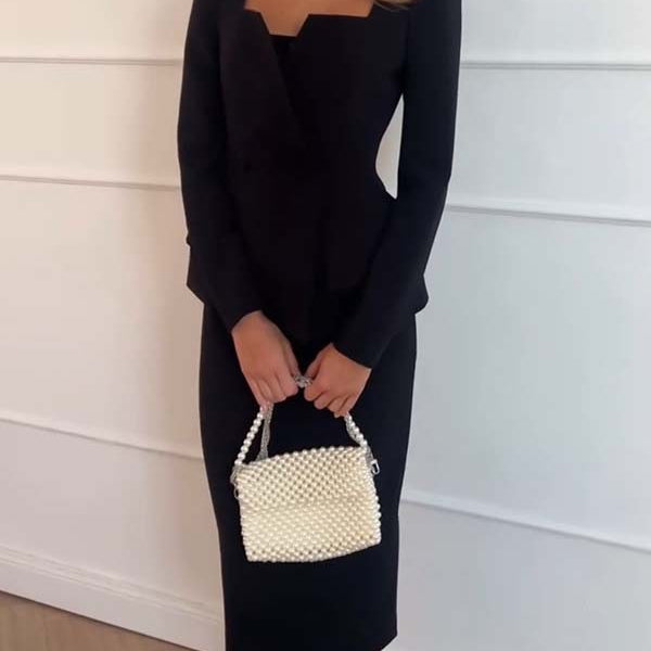 Elegant black long sleeve dress with pearl handbag in fashionable office two-piece set