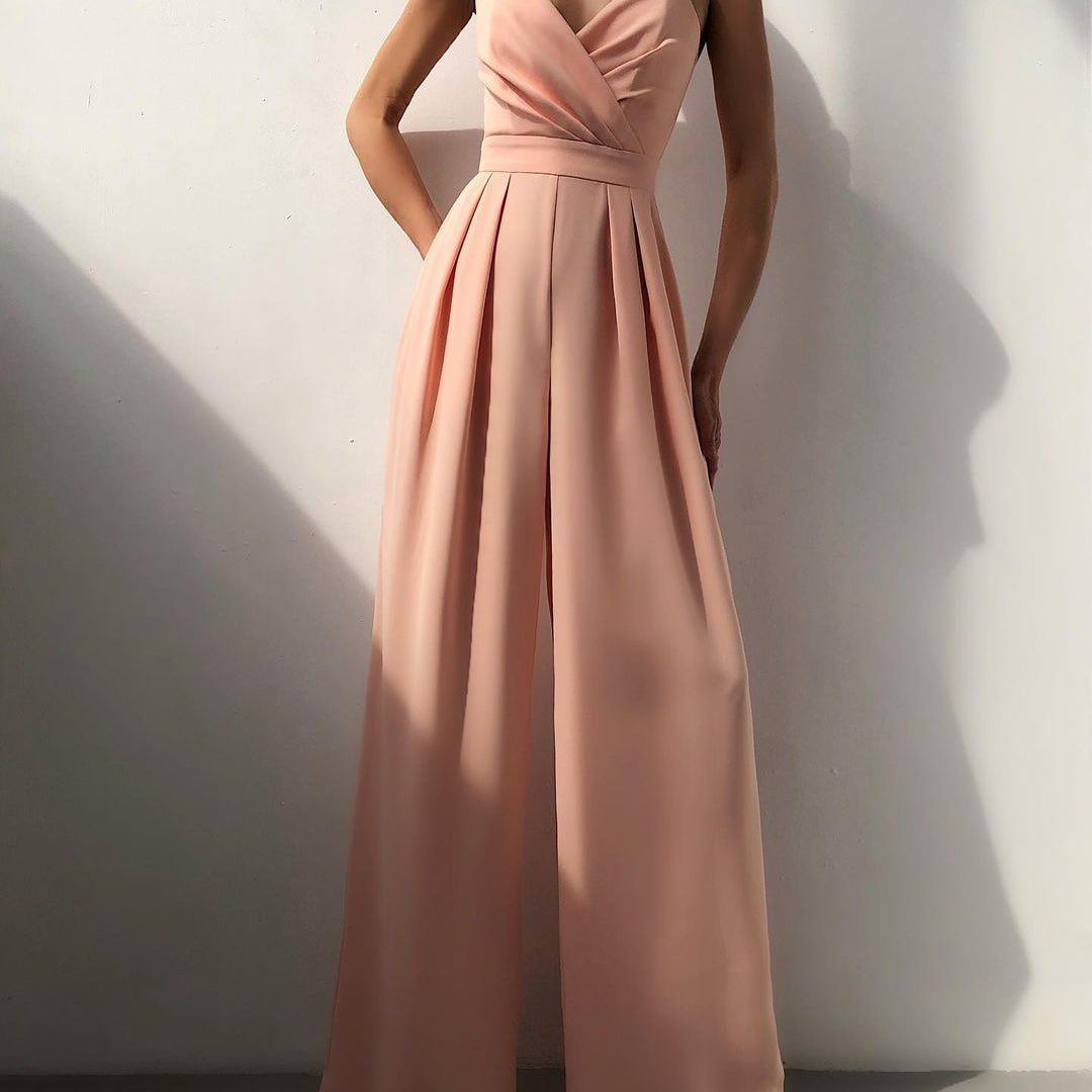Blush pink strapless jumpsuit with pleated wide-leg pants, perfect for modern fashion ملابس