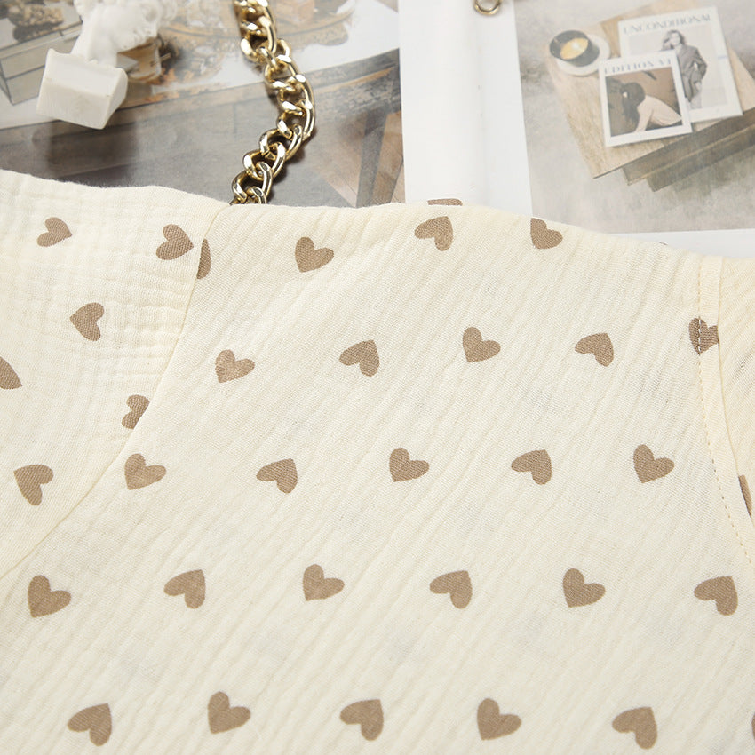 Light-colored cotton linen fabric with small brown heart pattern for summer slit shorts set