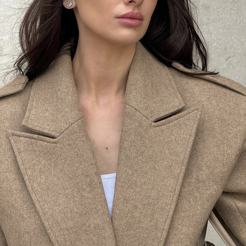 Elegant beige wool langry fashion coat with double-breasted notched lapels