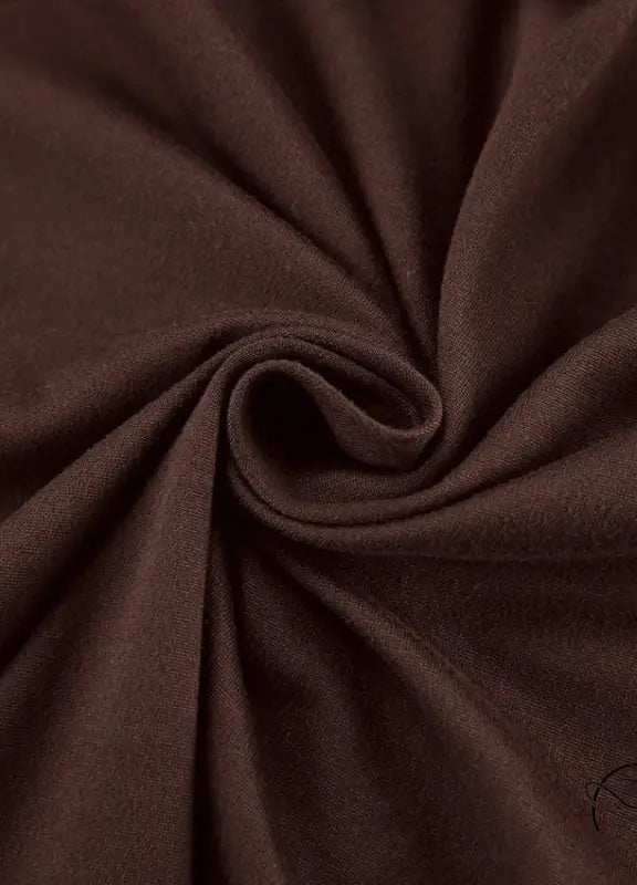 Close-up of rich brown comfortable knitted pajamas fabric