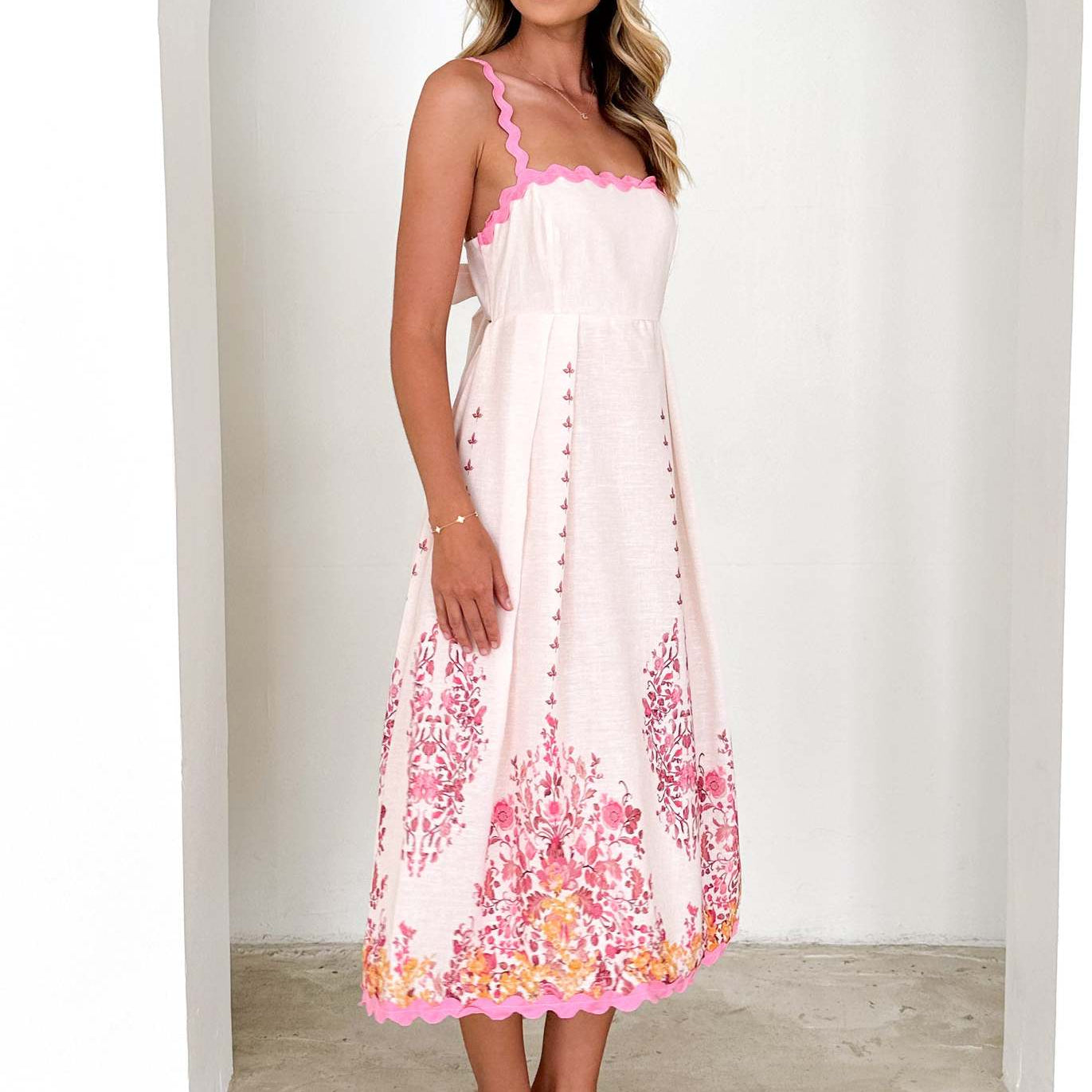 White sundress with pink floral print, stylish backless design for trendy fashion ملابس