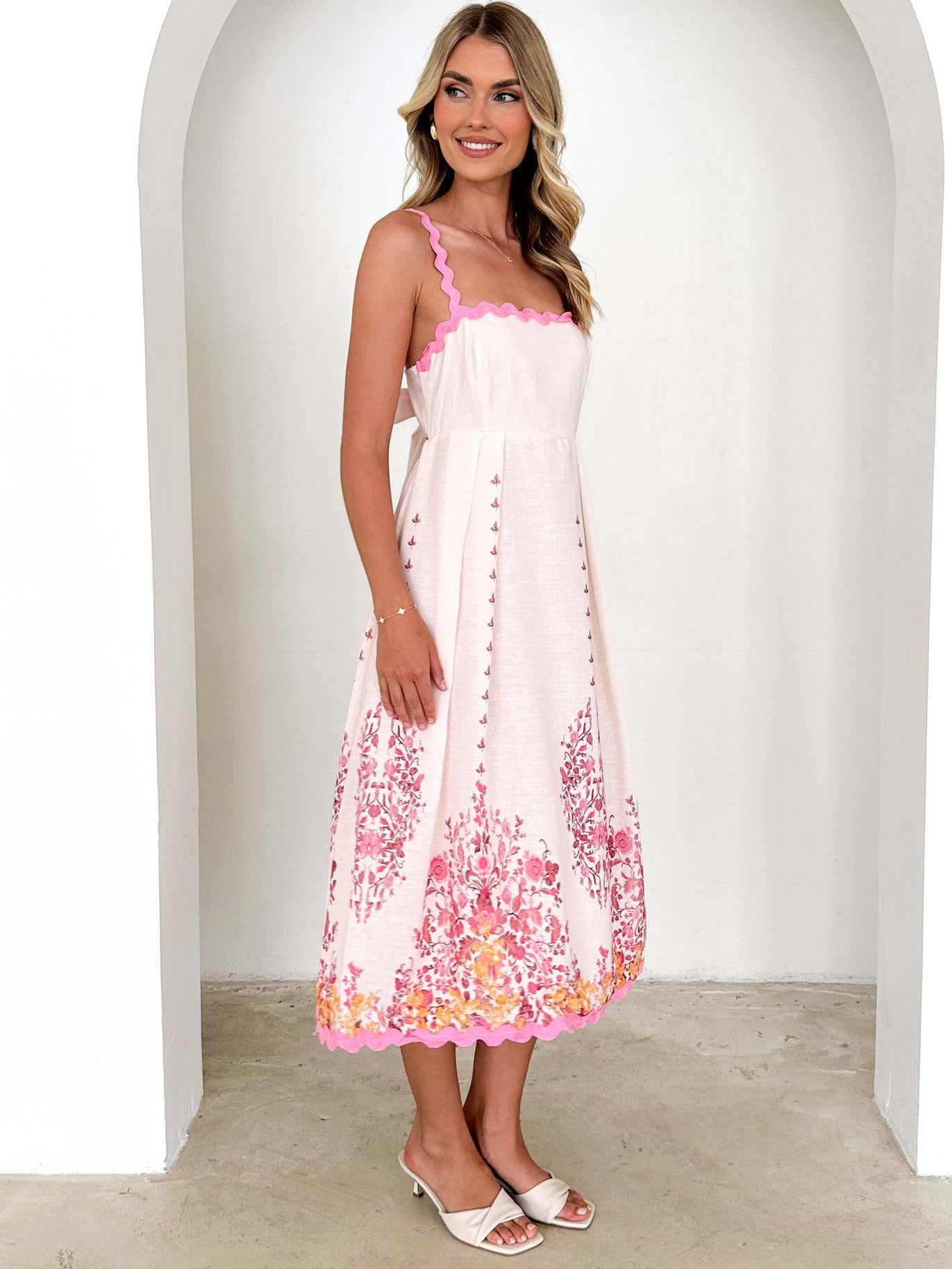 White sundress with pink floral print, stylish backless design for trendy fashion ملابس