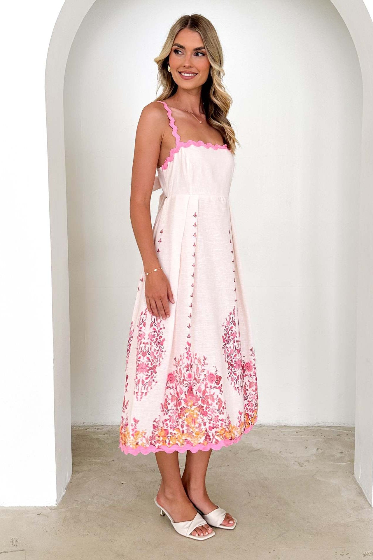 White sundress with pink floral print, stylish backless design for trendy fashion ملابس