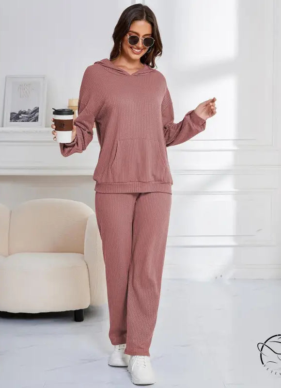 Woman in mauve ribbed hooded casual suit lounge set