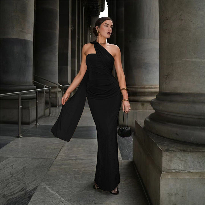 Elegant black maxi dress with one-shoulder design, perfect for fashionable evening wear