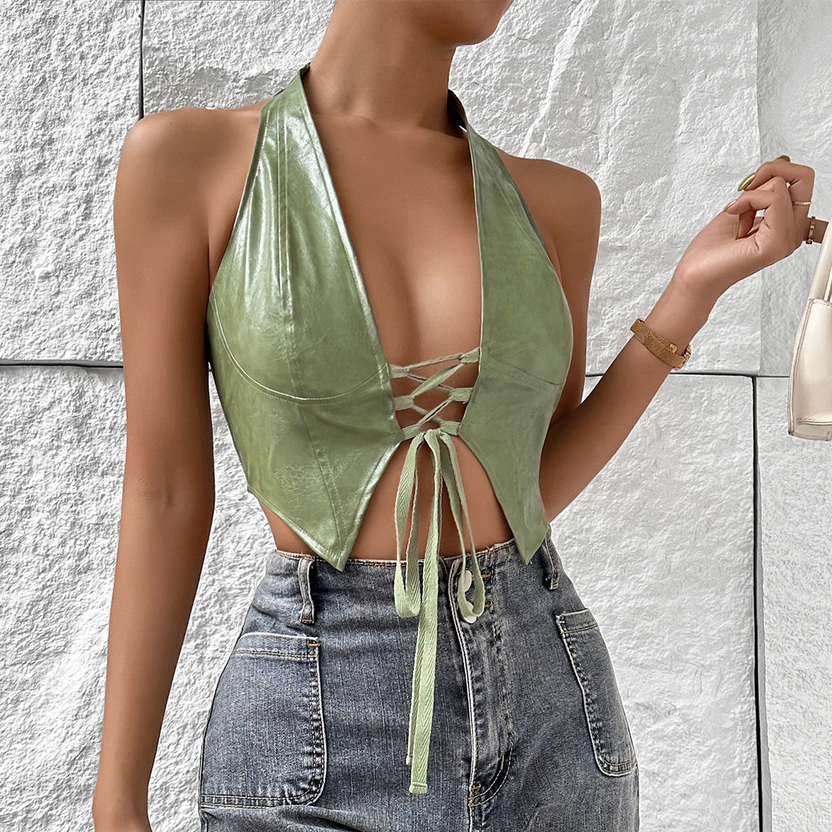 Light green solid color halter top with deep V-neck and front lace-up tie