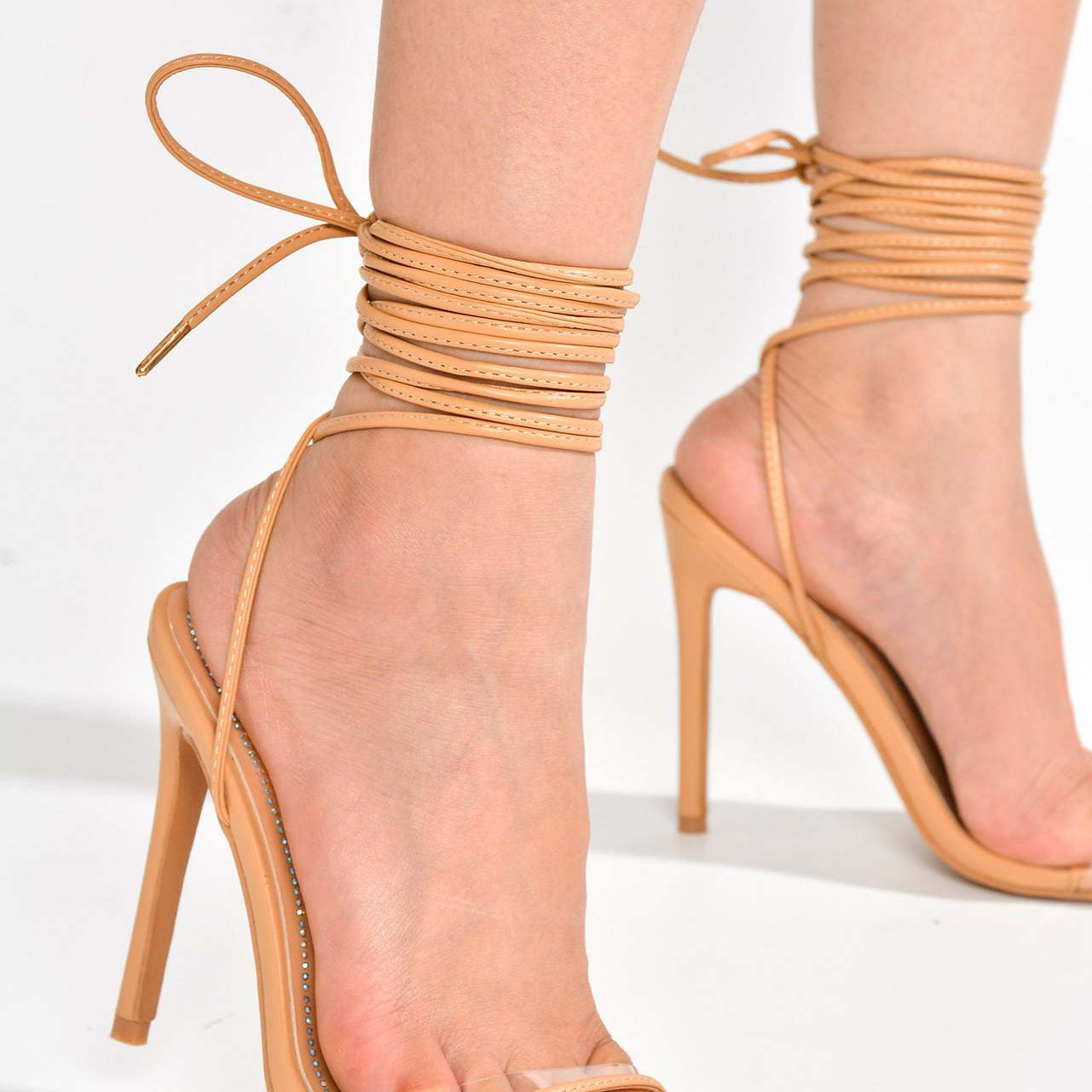 Nude strappy stiletto heels for fashion and ملابس, perfect for elegant style
