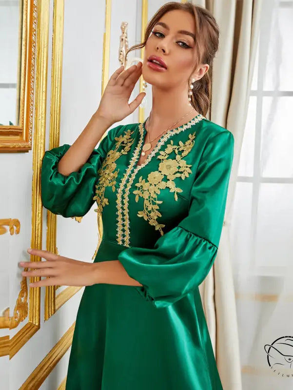 Emerald green satin langry fashion dress with gold floral embroidery and bell sleeves