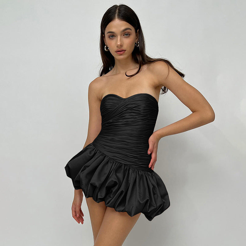 Black strapless mini dress with ruched bodice, perfect for summer fashion ملابس