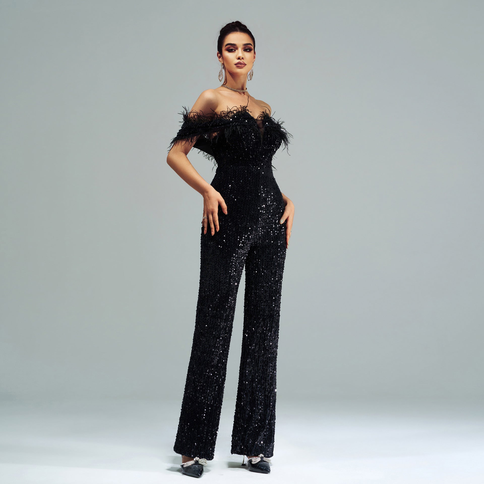 Sequin-covered black jumpsuit with feather trim, high-end fashion ملابس for elegant events