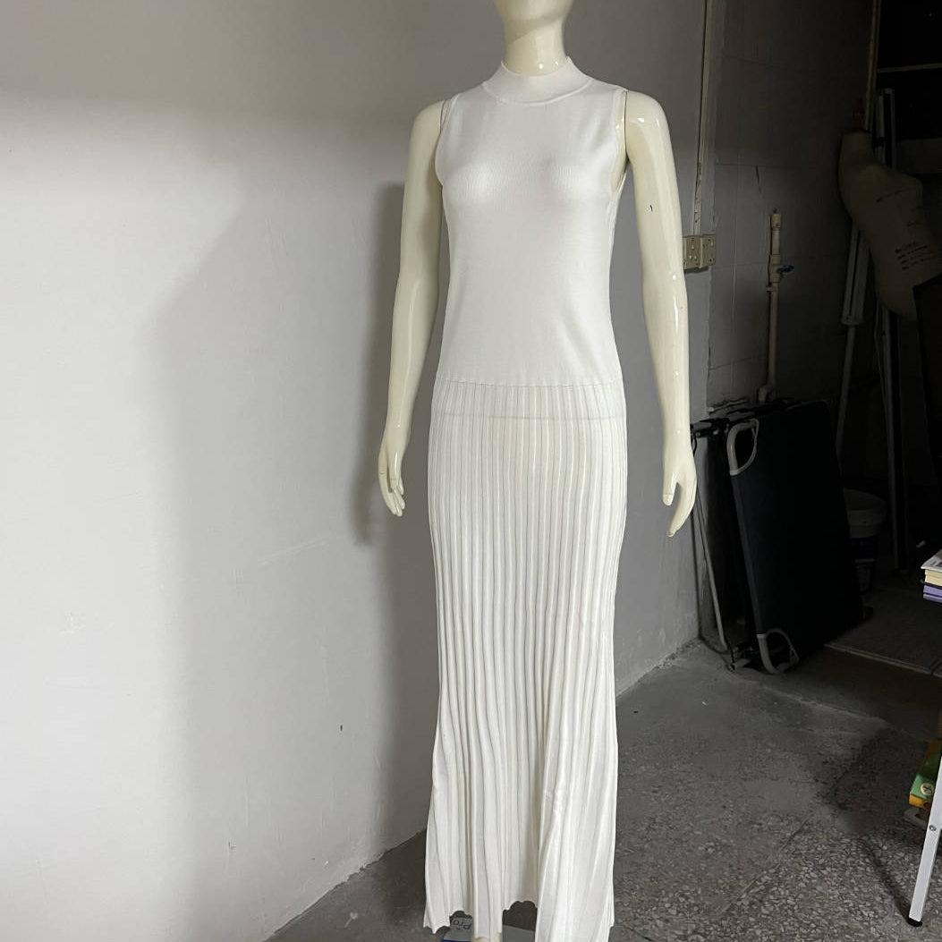 White sleeveless ribbed maxi dress on mannequin, showcasing elegant fashion design