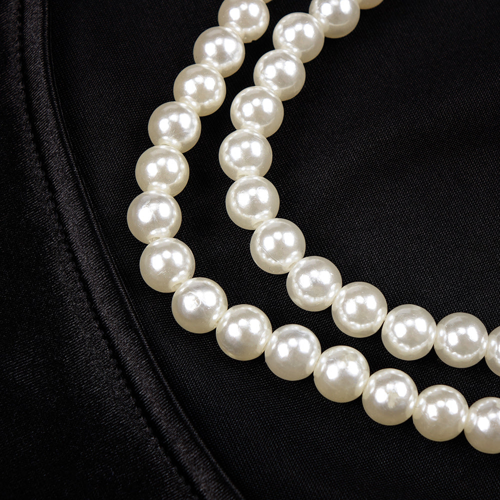 Lustrous pearl necklace complements elegant women’s fashion and ملابس in stylish style