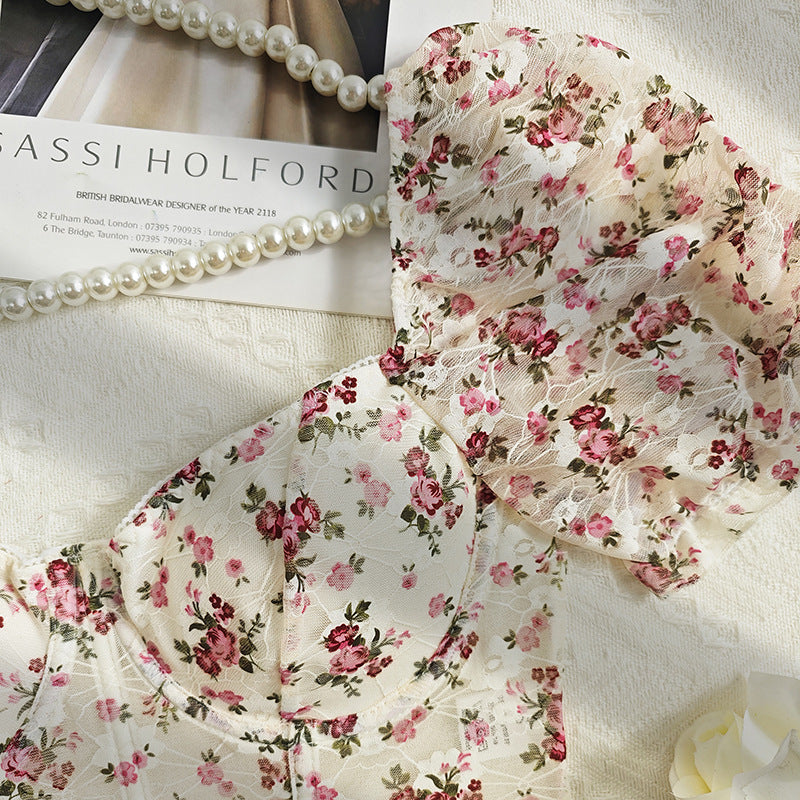 Floral lace bustier top with short sleeve design, perfect for fashion-forward styling
