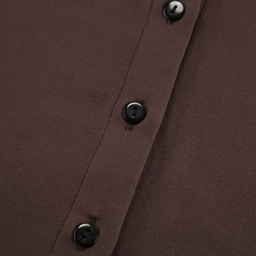 Close-up of a brown long sleeve pants with black buttons in knitted two-piece suit