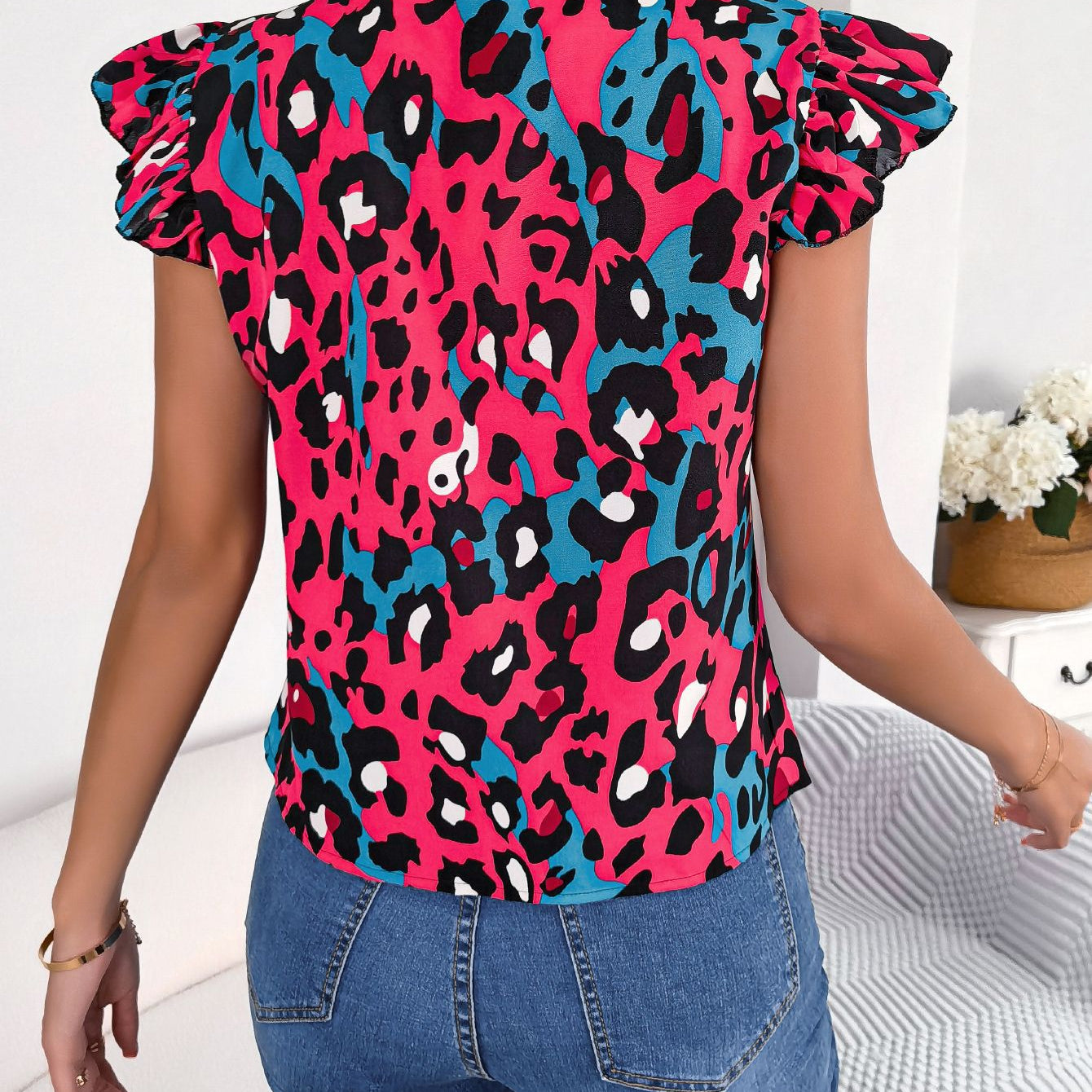 Women’s casual leopard print blouse top in fuchsia, black, and teal with ruffled sleeves