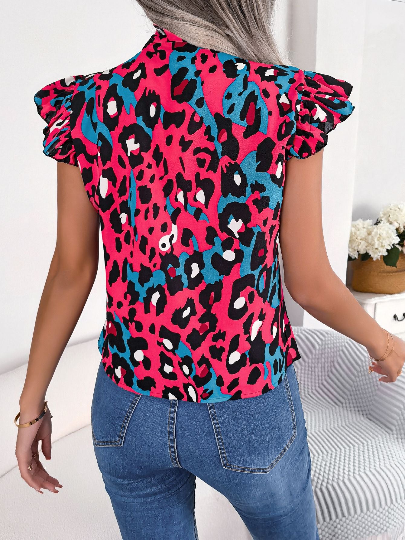 Women’s casual leopard print blouse top in fuchsia, black, and teal with ruffled sleeves