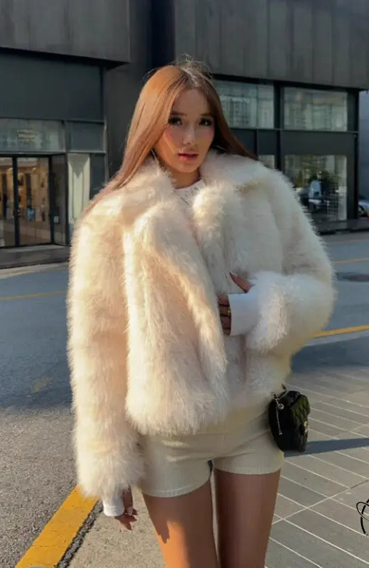 Cream faux fur oversized coat with fluffy texture and wide collar by Langry