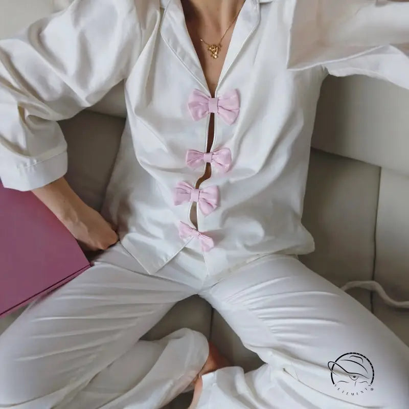 Elegant white satin langry pajama set with pink bows and gold necklace